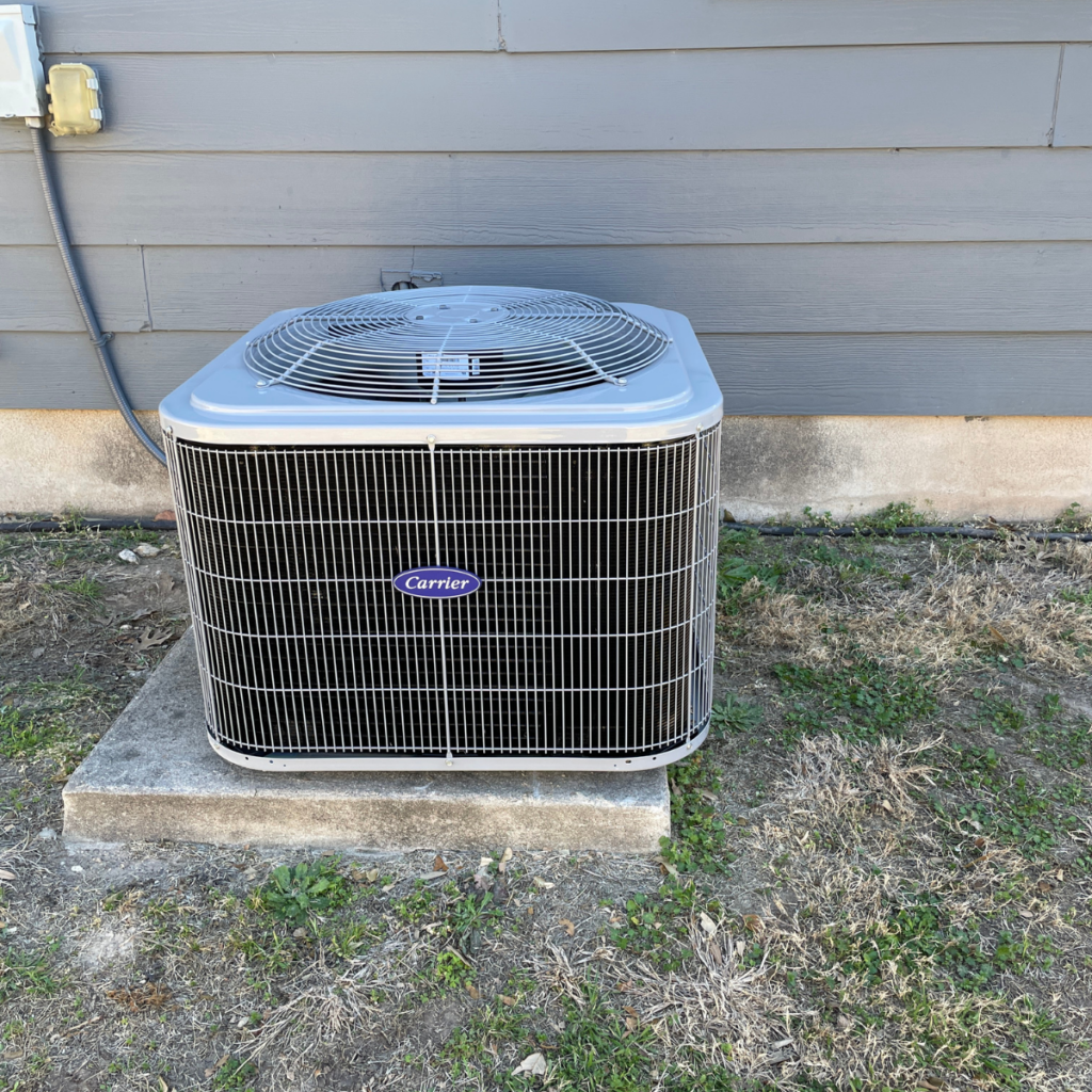 outdoor carrier hvac unit positioned outside of home
